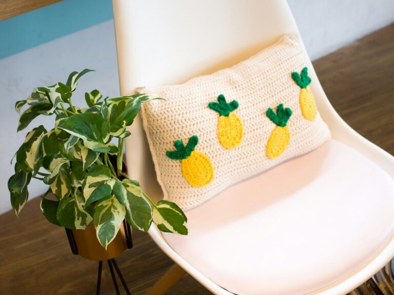 Close view of a handmade textured crochet cushion; photo Jacqueline Liban